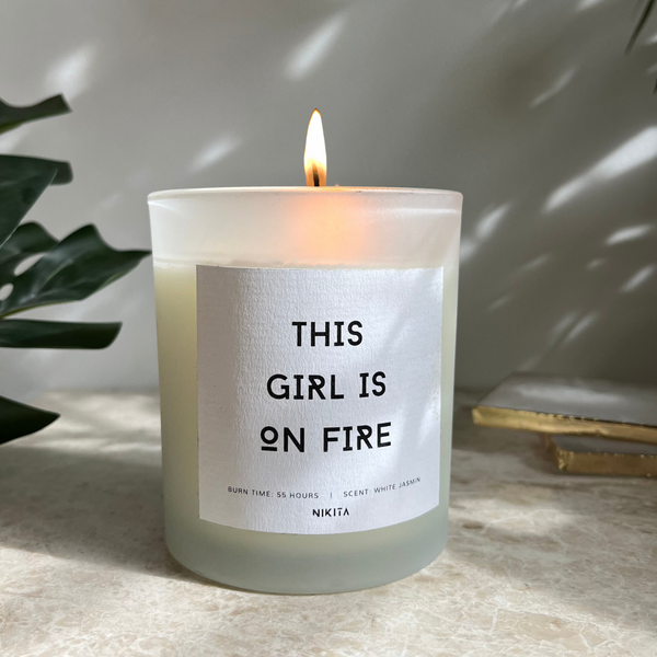 NIKITA Empowering white frosted glass candle, labelled 'Ignite your inner power'. Featuring a white jasmine scent. Christmas or birthday home decor gift for her.