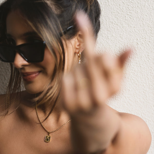NIKITA 'I am Savage' middle finger pendant necklace with quality 18k gold plating and a bold twist adjustable twist chain. A fun gift for best friend.