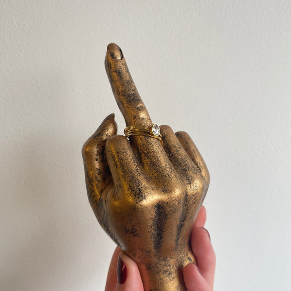 NIKITA gold brass middle finger ornament or ring holder. Fun and quirky home décor.