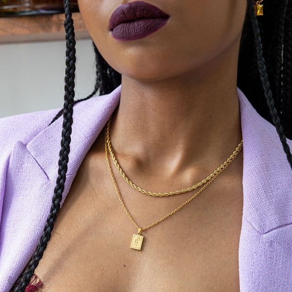 NIKITA Queen card pendant necklace engraved with a unique line drawing design. A waterproof 18k gold plated charm with a hypoallergenic stainless steel base. Christmas everyday jewellery gift for her.