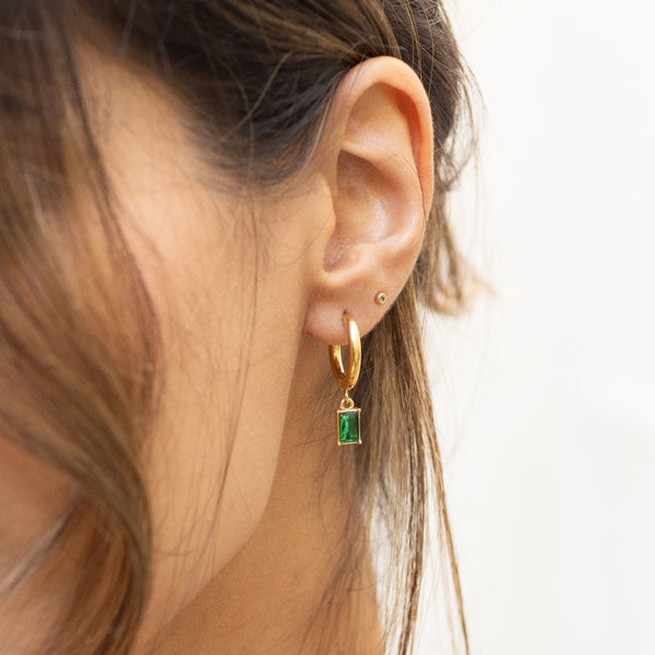 NIKITA emerald crystal pendant hoop earrings with an 18k gold plated finish. Small hoops for women made with a quality water-resistant, hypoallergenic stainless steel base. Christmas everyday jewellery gift for her.