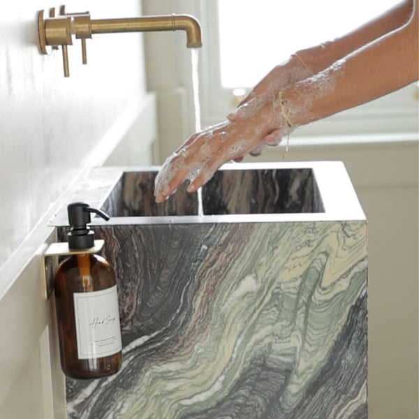 NIKITA amber glass dispenser bottle set with stainless steel pumps for your kitchen or bathroom. Durable soap dispensers with waterproof labels for hand soap, dish soap, hand lotion or hand sanitiser.