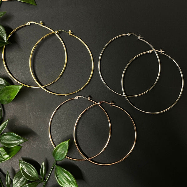 NIKITA oversized, large hoop earrings. Waterproof and hypoallergenic 18k plated statement hoops with a stainless steel base. Everyday jewellery gift for her.