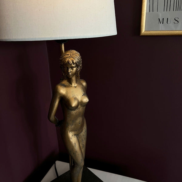 Luxury woman lamp, complete with cream lampshade. Antique style gold female figure table lamp.