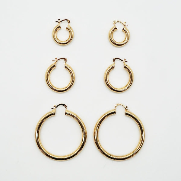 NIKITA Lexi huggie hoop statement earrings with an 18k gold plated finish. Hoops for women made with a quality water-resistant, hypoallergenic stainless steel base. Christmas everyday jewellery gift for her.