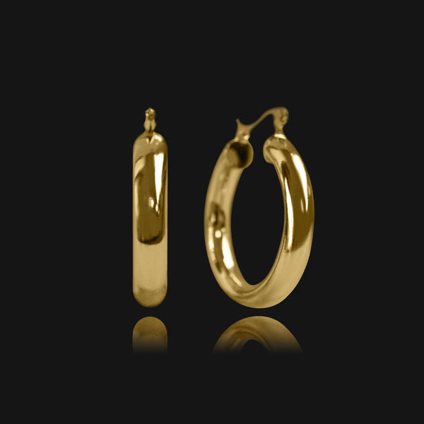 NIKITA Lexi medium thick hoop statement earrings with an 18k gold plated finish. Hoops for women made with a quality water-resistant, hypoallergenic stainless steel base. Christmas everyday jewellery gift for her.