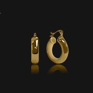 NIKITA Lexi huggie hoop statement earrings with an 18k gold plated finish. Hoops for women made with a quality water-resistant, hypoallergenic stainless steel base. Christmas everyday jewellery gift for her.