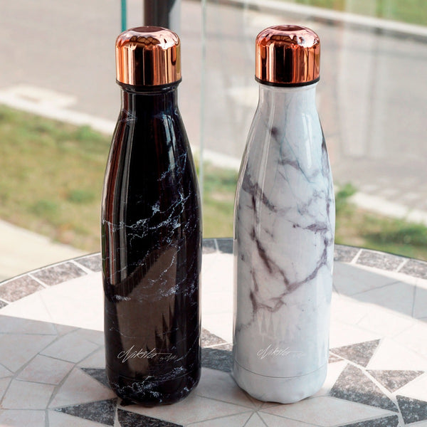 This luxury marble & rose gold metal water bottle is eco friendly, easy to clean and reusable. Available in black or white, the stainless steel bottle is easy to carry throughout your busy day,