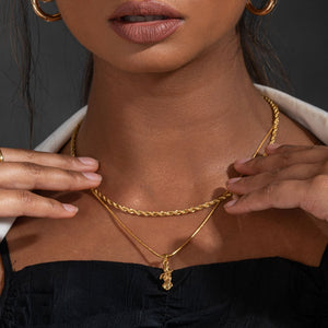 NIKITA woman pendant necklace with a unique female body design and 18k plated gold finish. A water-resistant pendant and adjustable chain made with a hypoallergenic stainless steel base. Christmas everyday jewellery gift for her.