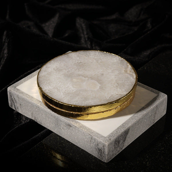 NIKITA natural crystal coaster set of 2 to use for mugs and glasses in your home. A coffee table accessory with a gold, silver or rose gold edge. Ideal christmas or new home gift for couples.
