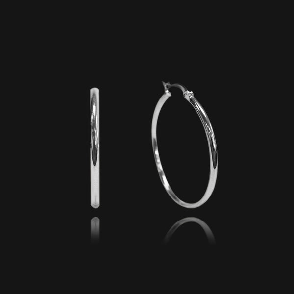 NIKITA classic, every day hoop earrings. Waterproof and hypoallergenic 18k plated hoops with a stainless steel base. Everyday jewellery gift for her.