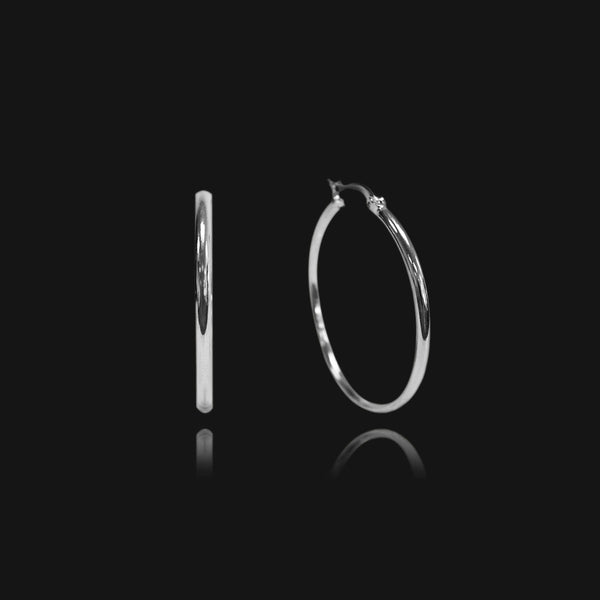 NIKITA classic, every day hoop earrings. Waterproof and hypoallergenic 18k plated hoops with a stainless steel base. Everyday jewellery gift for her.