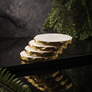 NIKITA solid marble coaster set of 4 to use for mugs and glasses in your home. A coffee table accessory with a gold, silver or rose gold leaf edge. Ideal christmas or new home gift for couples.