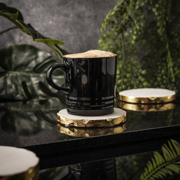 NIKITA solid marble coaster set of 4 to use for mugs and glasses in your home. A coffee table accessory with a gold, silver or rose gold leaf edge. Ideal christmas or new home gift for couples.