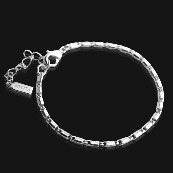 NIKITA flat link chain bracelet with adjustable sizing. 18k gold plated with a hypoallergenic stainless steel base. Christmas everyday jewellery gift for her.