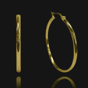NIKITA oversized, large hoop earrings. Waterproof and hypoallergenic 18k plated statement hoops with a stainless steel base. Everyday jewellery gift for her.