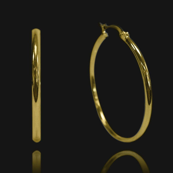 NIKITA oversized, large hoop earrings. Waterproof and hypoallergenic 18k plated statement hoops with a stainless steel base. Everyday jewellery gift for her.