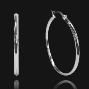 NIKITA oversized, large hoop earrings. Waterproof and hypoallergenic 18k plated statement hoops with a stainless steel base. Everyday jewellery gift for her.