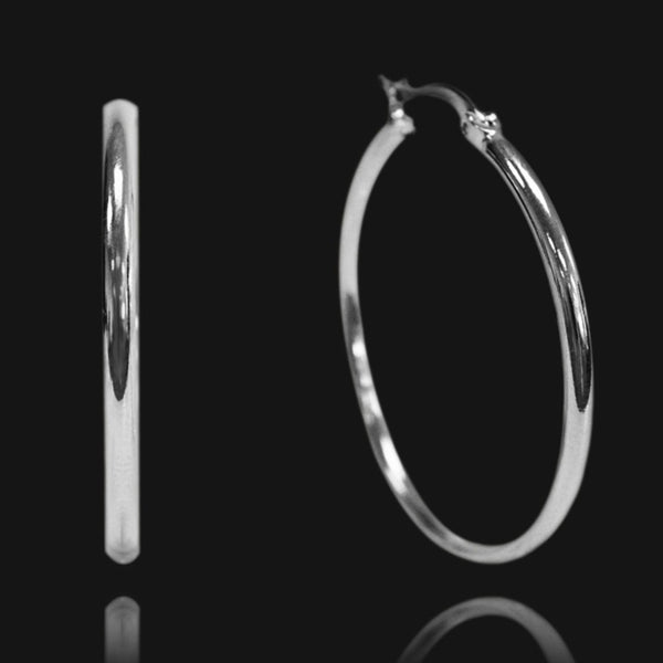 NIKITA oversized, large hoop earrings. Waterproof and hypoallergenic 18k plated statement hoops with a stainless steel base. Everyday jewellery gift for her.