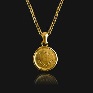 NIKITA 'I am Enough' engraved pendant necklace with a unique wax stamp inspired design and 18k plated gold finish. A water-resistant pendant and adjustable chain made with a hypoallergenic stainless steel base. Christmas everyday jewellery gift for her.