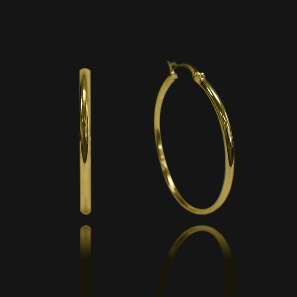 NIKITA classic, every day hoop earrings. Waterproof and hypoallergenic 18k plated hoops with a stainless steel base. Everyday jewellery gift for her.