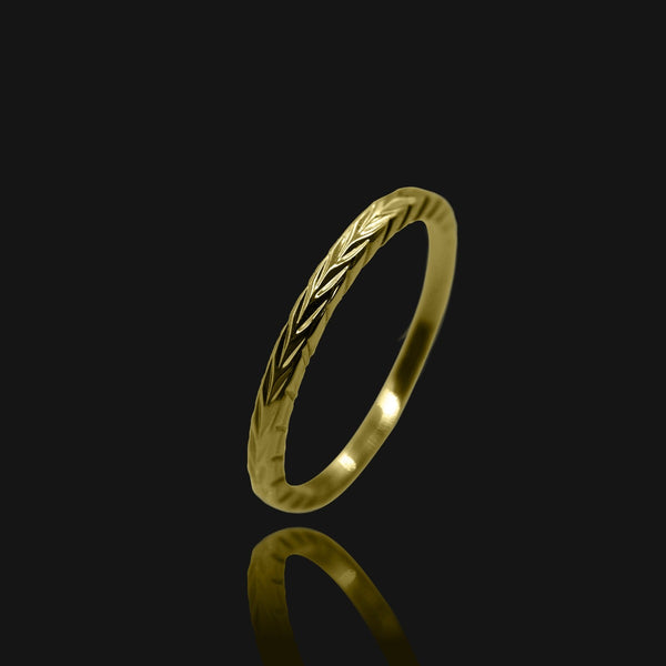 NIKITA Tala minimal ring with plaited design, to wear on your thumb or finger. Waterproof 18k gold plating and a hypoallergenic stainless steel base. Christmas everyday jewellery gift for her.