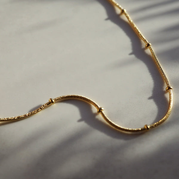 NIKITA interval beaded snake chain necklace. A waterproof 18k gold plated, quality chain, with a hypoallergenic stainless steel base. Every day jewellery gift for her.