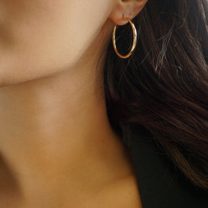 NIKITA classic, every day hoop earrings. Waterproof and hypoallergenic 18k plated hoops with a stainless steel base. Everyday jewellery gift for her.