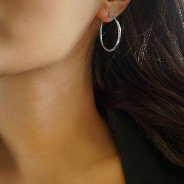 NIKITA classic, every day hoop earrings. Waterproof and hypoallergenic 18k plated hoops with a stainless steel base. Everyday jewellery gift for her.
