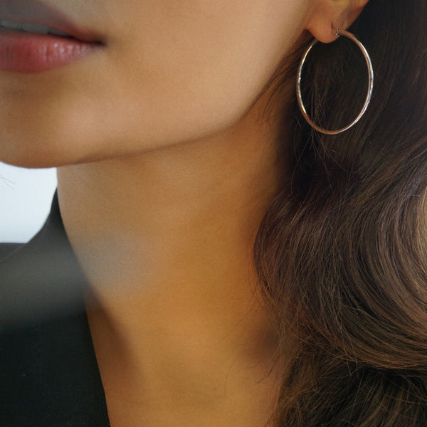 NIKITA classic, every day hoop earrings. Waterproof and hypoallergenic 18k plated hoops with a stainless steel base. Everyday jewellery gift for her.