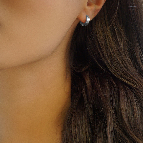 NIKITA Pixi small silver sleeper hoop earrings. Huggie hoops for women made with a quality water-resistant, hypoallergenic stainless steel base. Christmas everyday jewellery gift for her.