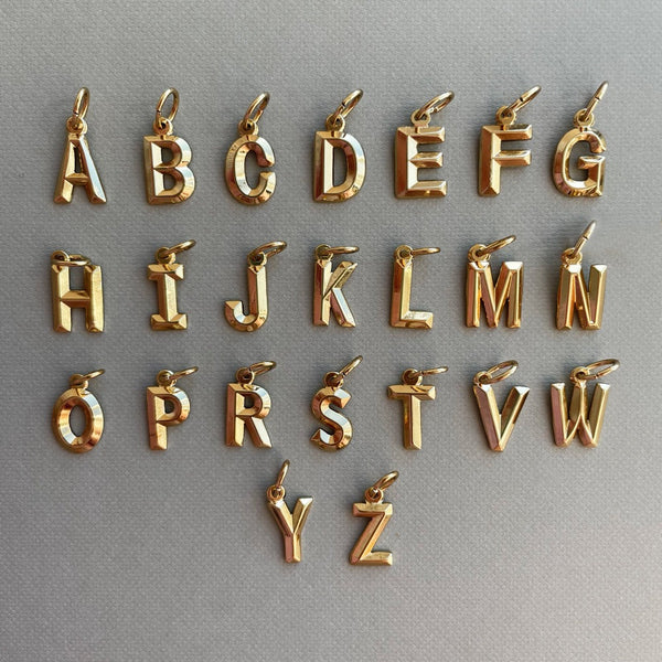 NIKITA custom initial pendant necklace with a unique, personalised letter design. A water-resistant 18k gold plated pendant and adjustable chain made with a hypoallergenic stainless steel base. Christmas everyday jewellery gift for her.