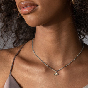 NIKITA evil eye pendant necklace with a unique precious moonstone centre and silver hammered finish. A water-resistant pendant and adjustable chain made with a hypoallergenic stainless steel base. Christmas everyday jewellery gift for her.