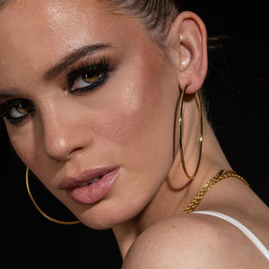 NIKITA oversized, large hoop earrings. Waterproof and hypoallergenic 18k plated statement hoops with a stainless steel base. Everyday jewellery gift for her.