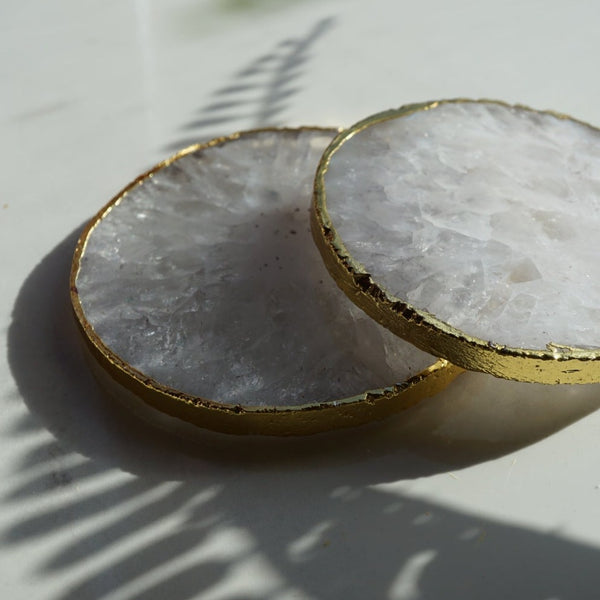 NIKITA natural crystal coaster set of 2 to use for mugs and glasses in your home. A coffee table accessory with a gold, silver or rose gold edge. Ideal christmas or new home gift for couples.