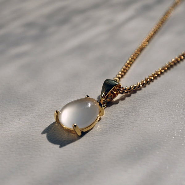 NIKITA natural moonstone pendant necklace with a unique precious stone teardrop design. A water-resistant pendant with quality 18k gold plating and adjustable chain made with a hypoallergenic stainless steel base. Christmas or Mother's Day everyday jewellery gift for her.