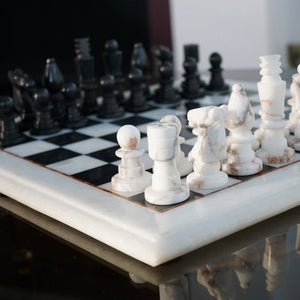 NIKITA Marble black and white monochrome chess board with 32 hand made pieces. A luxury gaming chess set that will also make a decorative homeware piece. Christmas or birthday gift for her or gift for couples.