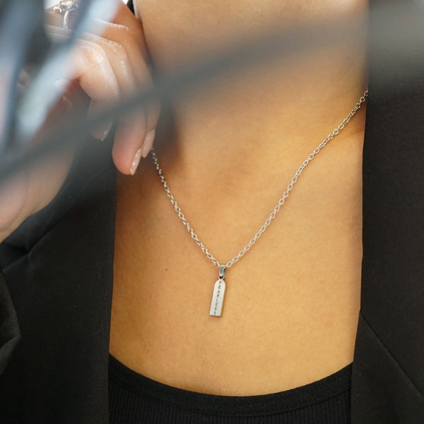 NIKITA fearless engraved bar pendant necklace. A waterproof silver charm and quality chain, with a hypoallergenic stainless steel base. Christmas everyday jewellery gift for her.