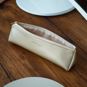 Introducing our gold vegan leather adult pencil case featuring a muted gold zip and embossed Nikita by Niki logo. A quality, mature case to store pens, pencils, makeup brushes and more. The perfect gift for any stationery addict.