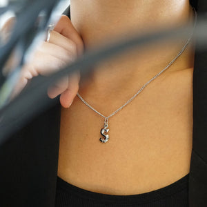 NIKITA custom initial pendant necklace with a unique, personalised letter design. A water-resistant silver pendant and adjustable chain made with a hypoallergenic stainless steel base. Christmas everyday jewellery gift for her.