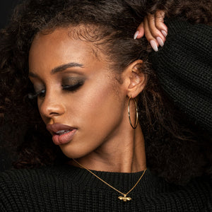 NIKITA classic, every day hoop earrings. Waterproof and hypoallergenic 18k plated hoops with a stainless steel base. Everyday jewellery gift for her.