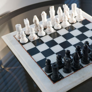 NIKITA Marble black and white monochrome chess board with 32 hand made pieces. A luxury gaming chess set that will also make a decorative homeware piece. Christmas or birthday gift for her or gift for couples.