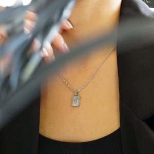 NIKITA Queen card pendant necklace engraved with a unique line drawing design. A waterproof silver charm with a hypoallergenic stainless steel base. Christmas everyday jewellery gift for her.
