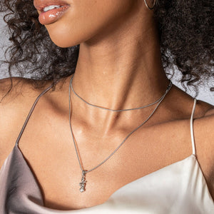 NIKITA woman pendant necklace with a unique female body design. A water-resistant pendant and adjustable chain made with a hypoallergenic stainless steel base. Christmas everyday jewellery gift for her.